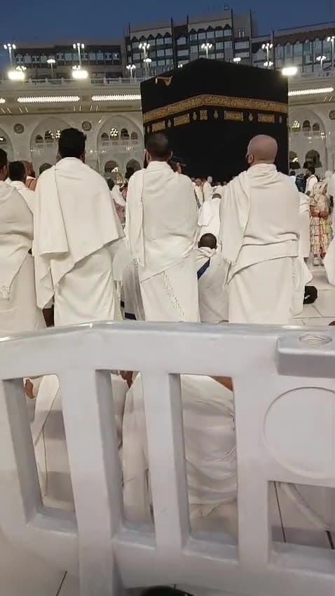 Our pilgrims in ihram before the Kaaba, inside Masjid al-Haram
